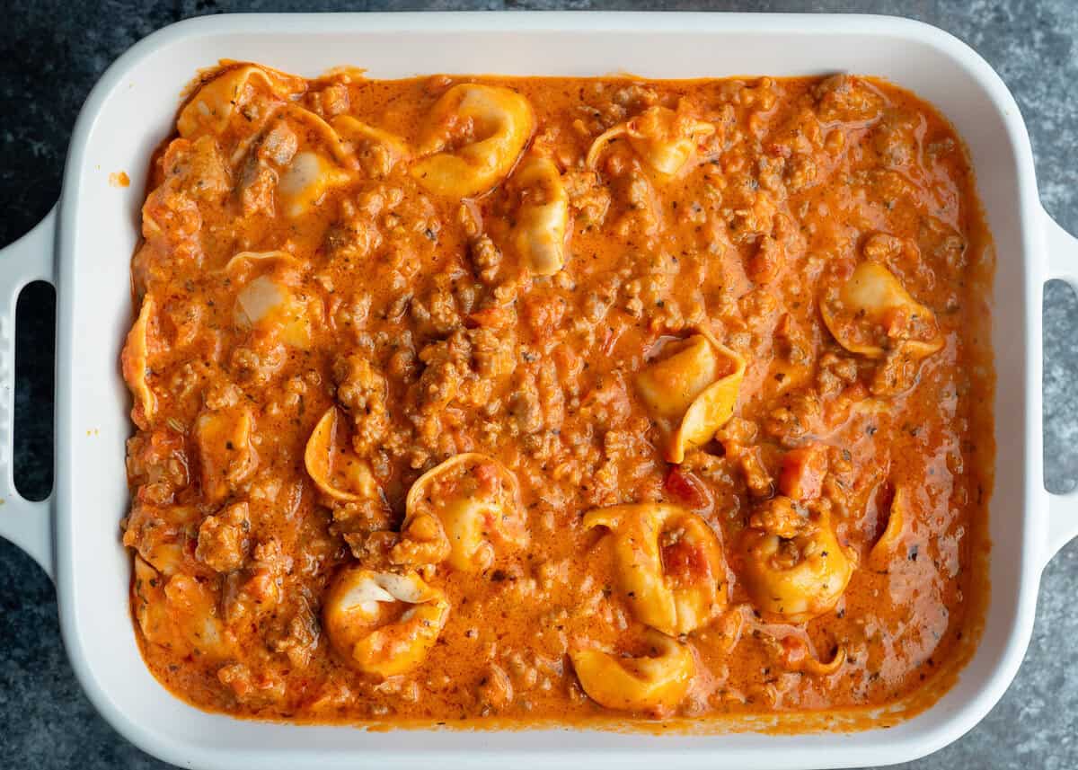 Tortellini and sausage mixture in a baking dish