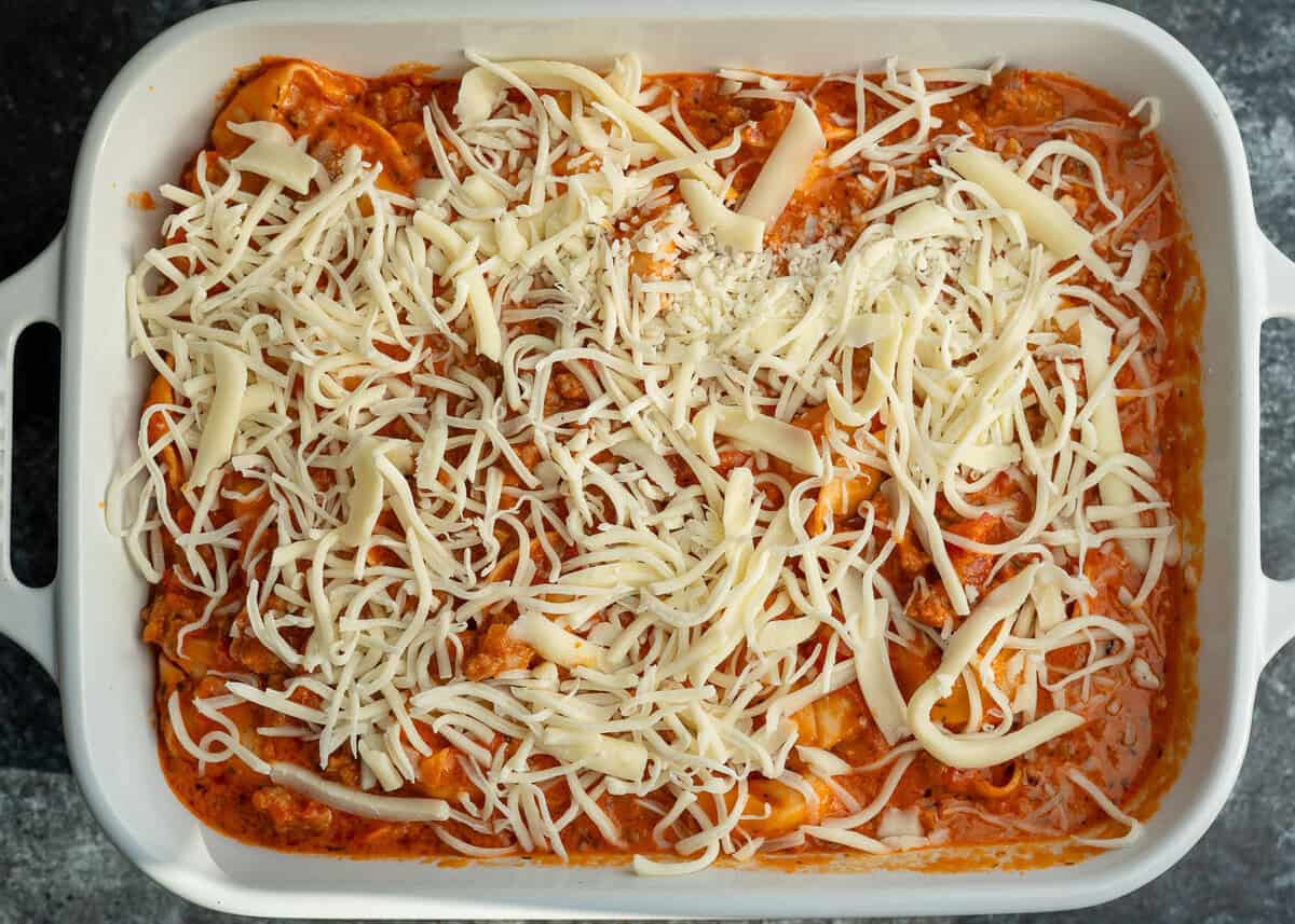 shredded mozzarella sprinkled over the tortellini casserole mixture