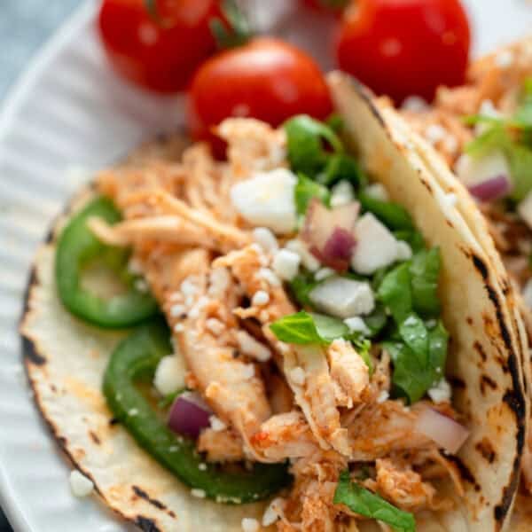 closeup showing juicy chicken tinga tacos