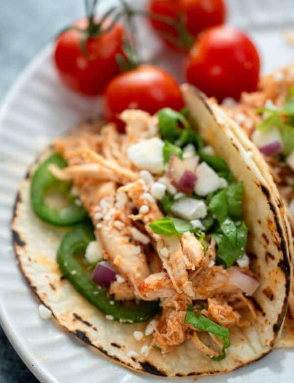 closeup showing juicy chicken tinga tacos