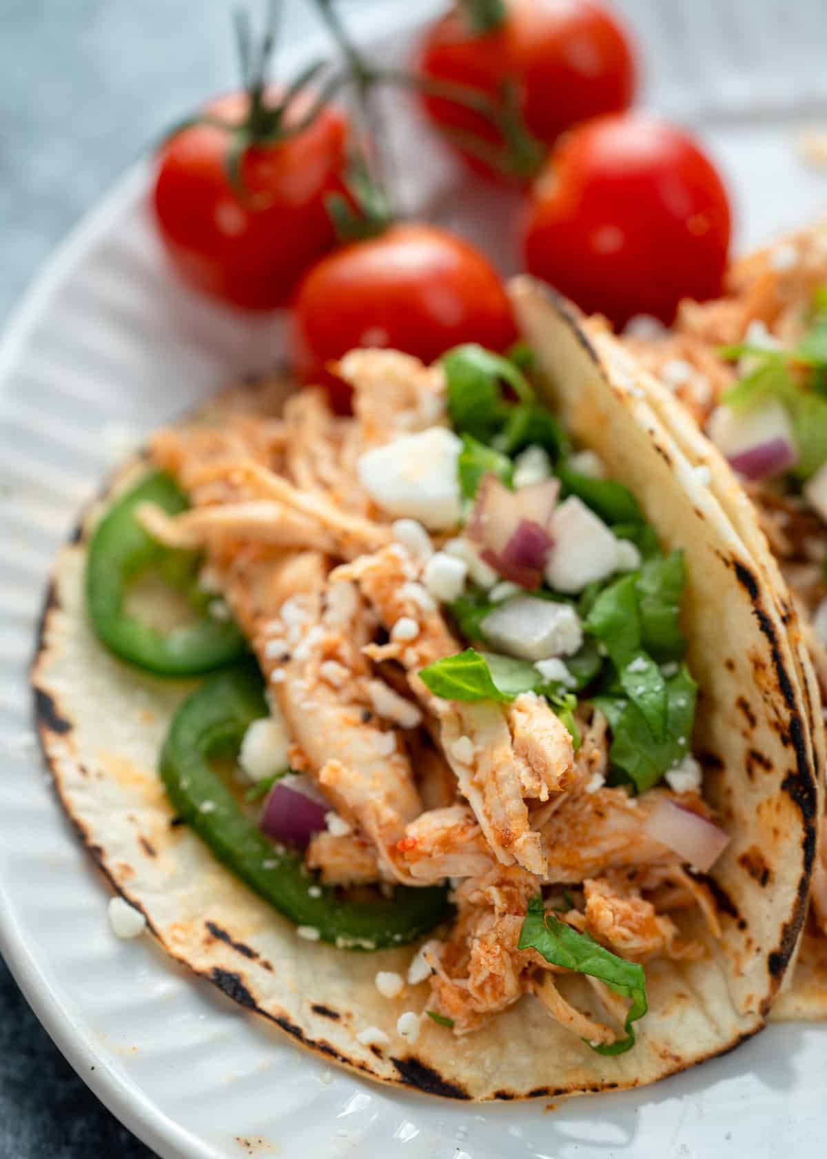 closeup showing juicy chicken tinga tacos