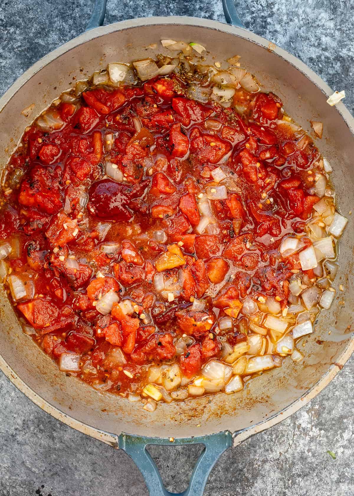 onions, garlic, fire roasted tomatoes, chipotle pepper, and adobo sauce in a skillet