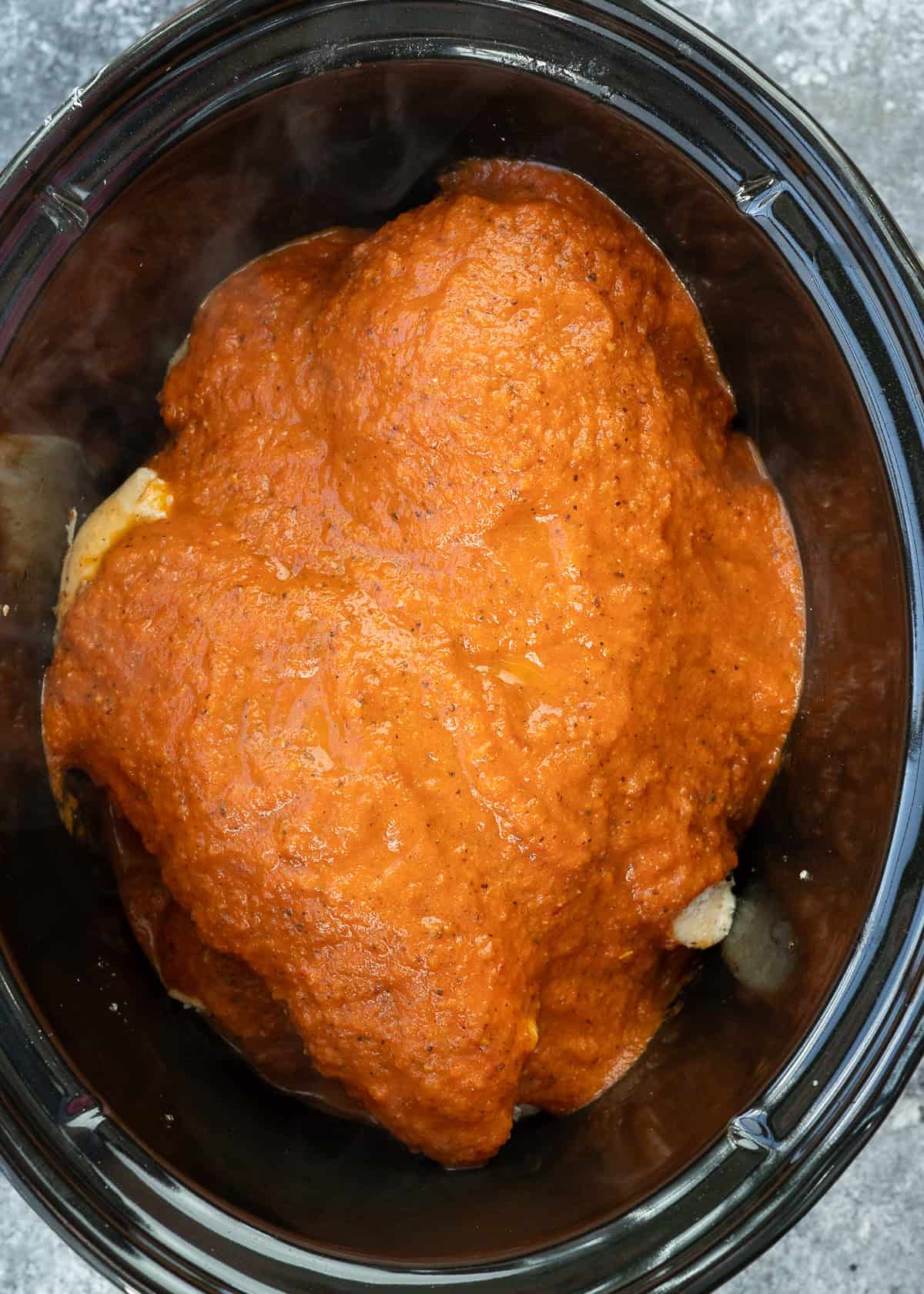 chicken breasts covered in tinga sauce