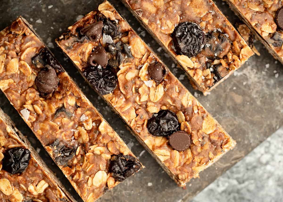 overhead image of 4 homemade granola bars on stone background