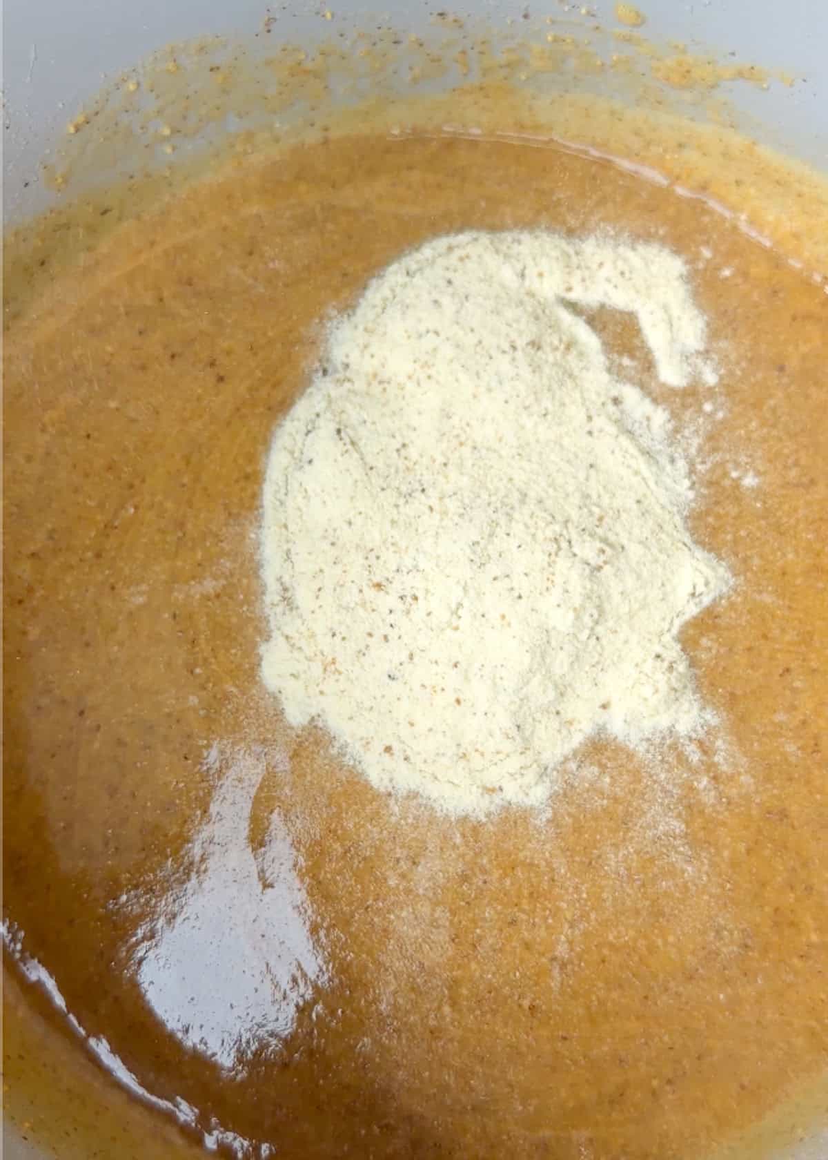 almond butter and protein powder in a mixing bowl