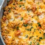melty cheese and chopped herbs atop an easy stuffed pepper skillet