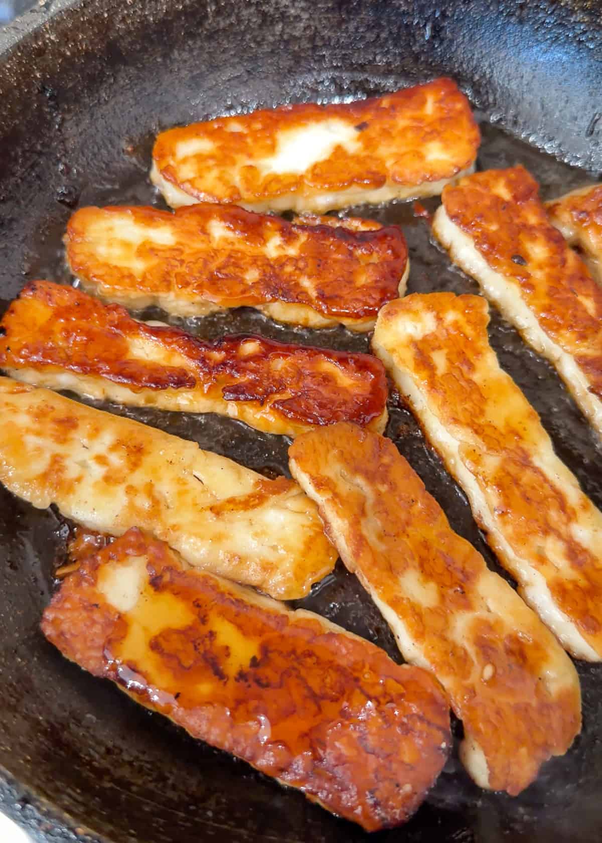 hot honey halloumi in a skillet
