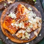 an overhead shot of hot honey salmon on a tostada