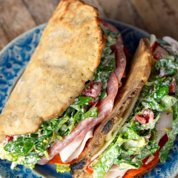 overhead shot showing two grinder sandwiches with homemade gluten free sandwich bread