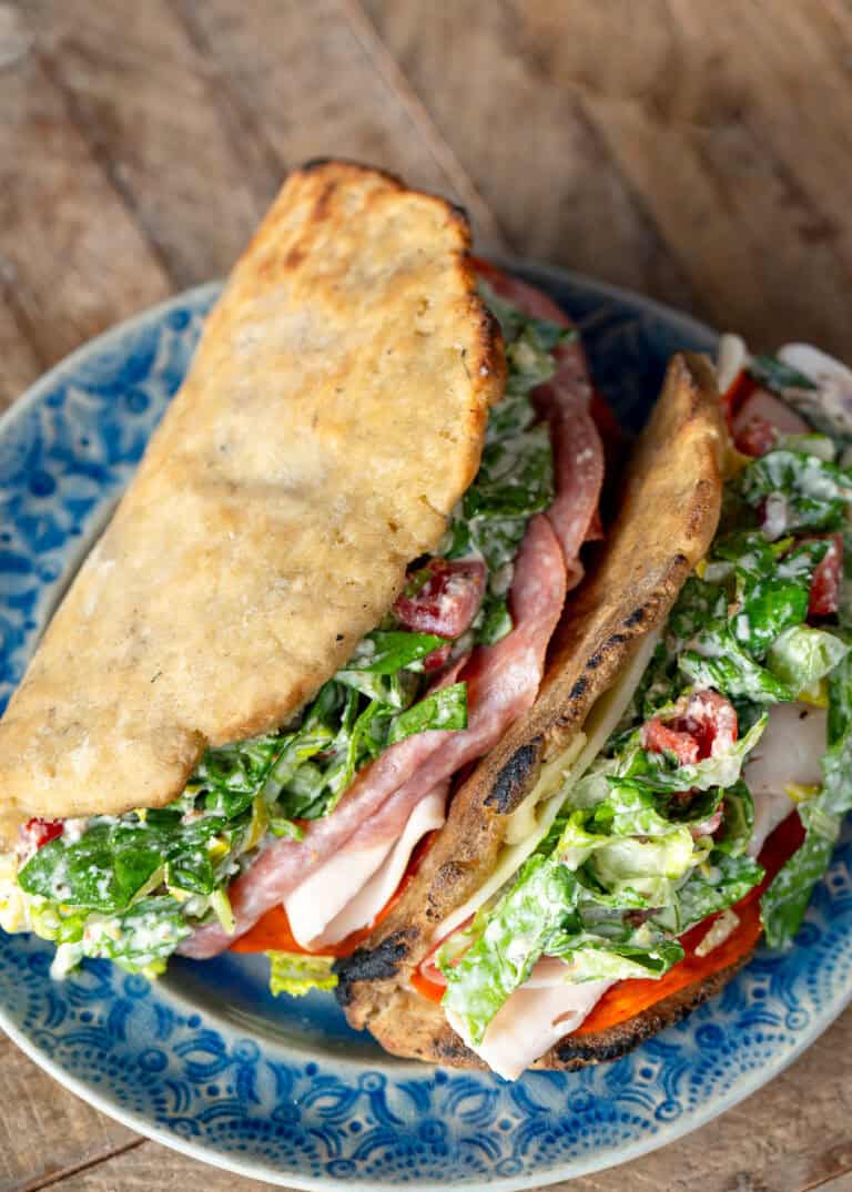 overhead shot showing two grinder sandwiches with homemade gluten free sandwich bread