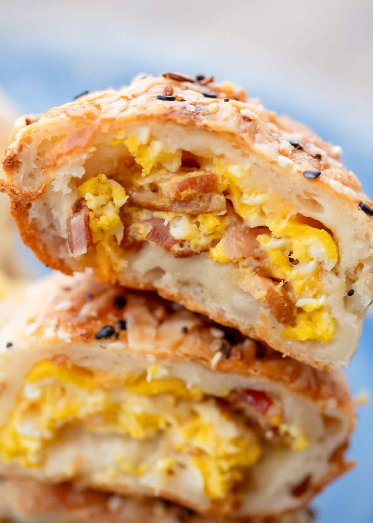 closeup view of breakfast roll filled with bacon egg and cheese in a high protein breakfast hot pocket