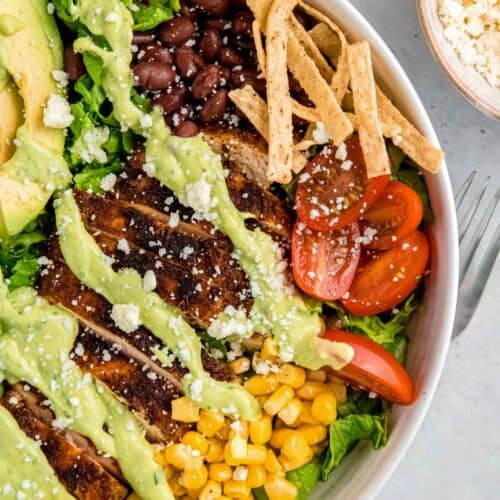 close, overhead image of a southwest chicken salad in a white bowl