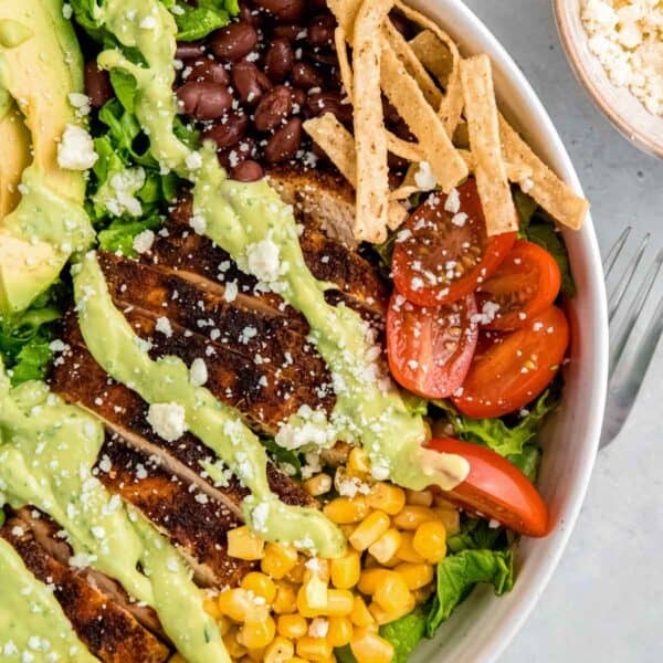 close, overhead image of a southwest chicken salad in a white bowl