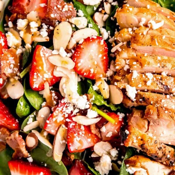 close up image of garnished strawberry spinach salad