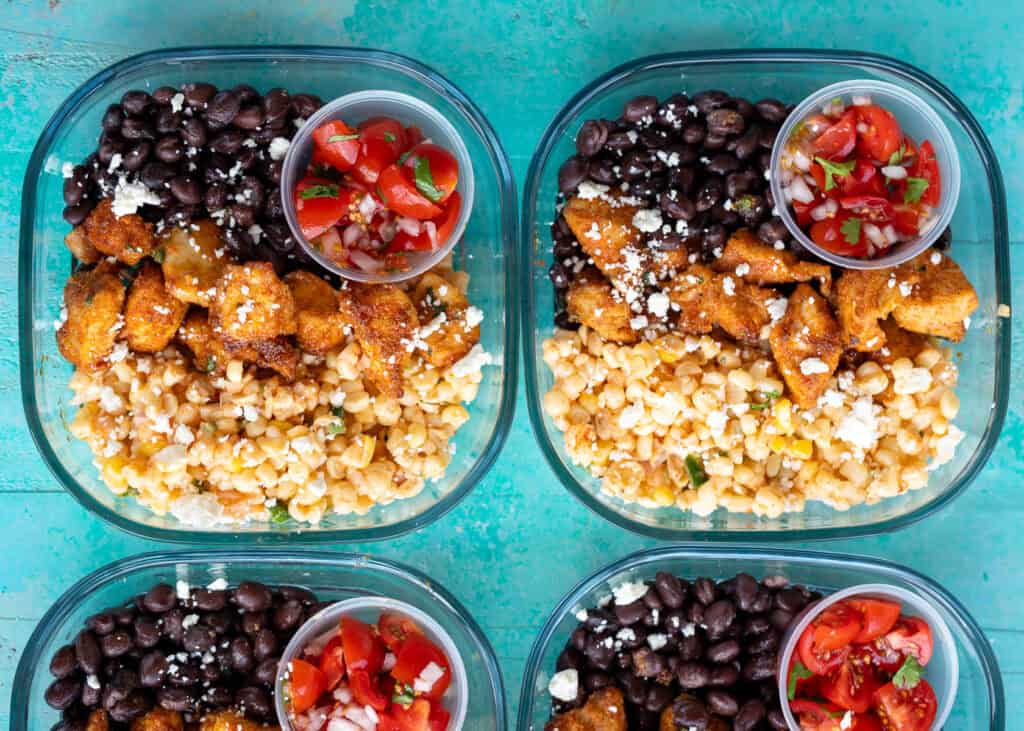 an overhead shot of mexican street corn meal prep lunches