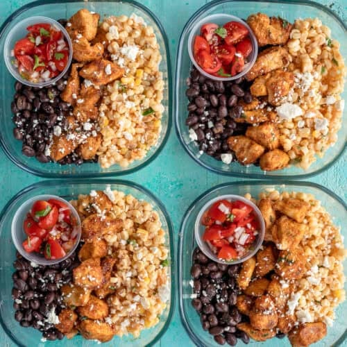 an overhead shot of mexican street corn meal prep bowls