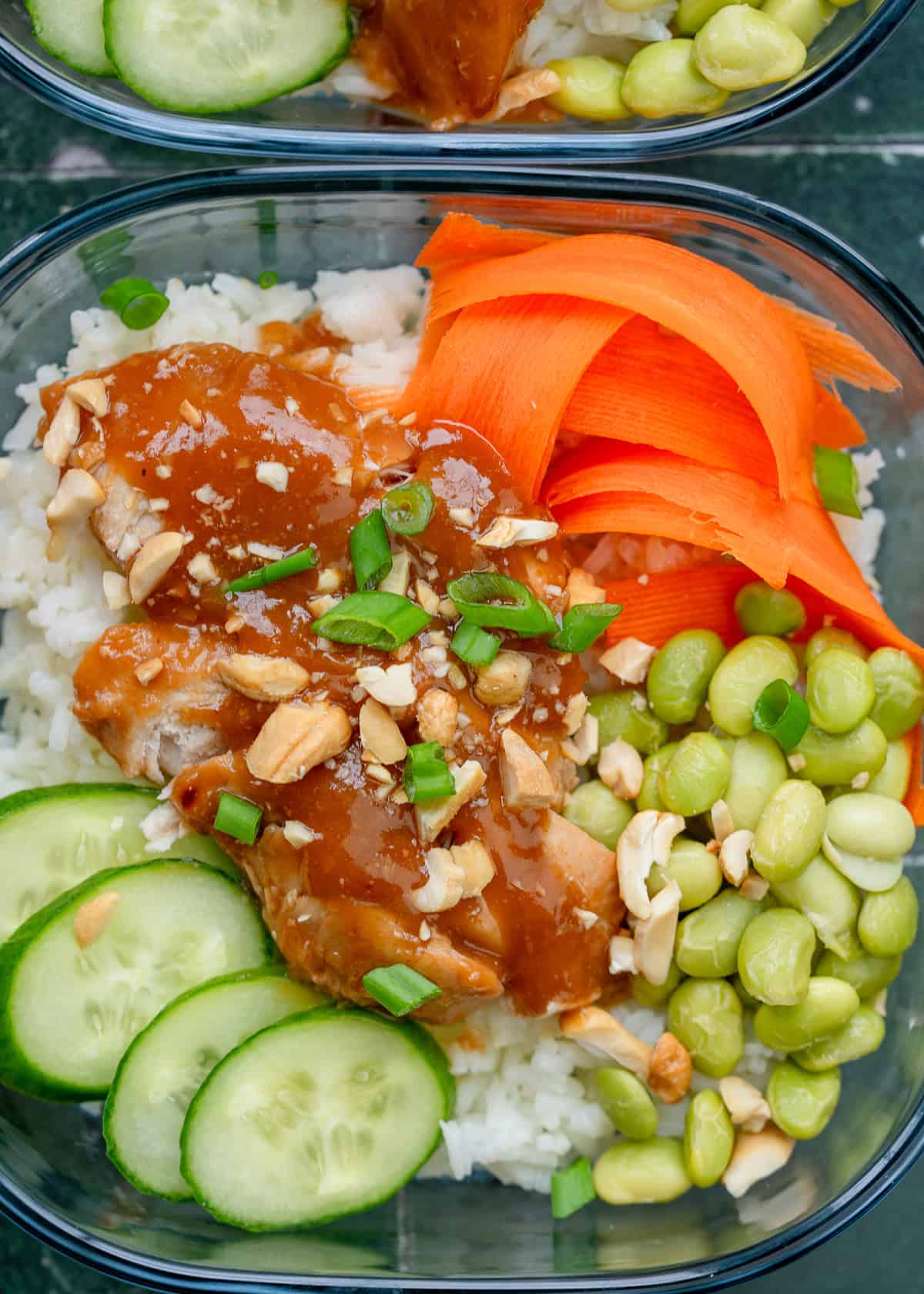 a closeup shot of chicken meal prep lunch bowls