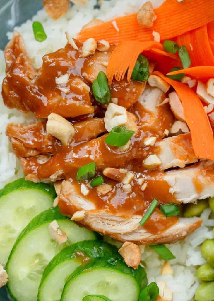 a very close up shot of asian chicken meal prep bowls