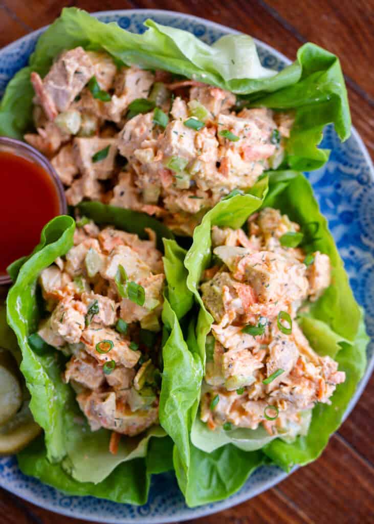 an overhead shot of high protein buffalo chicken salad in lettuce cups