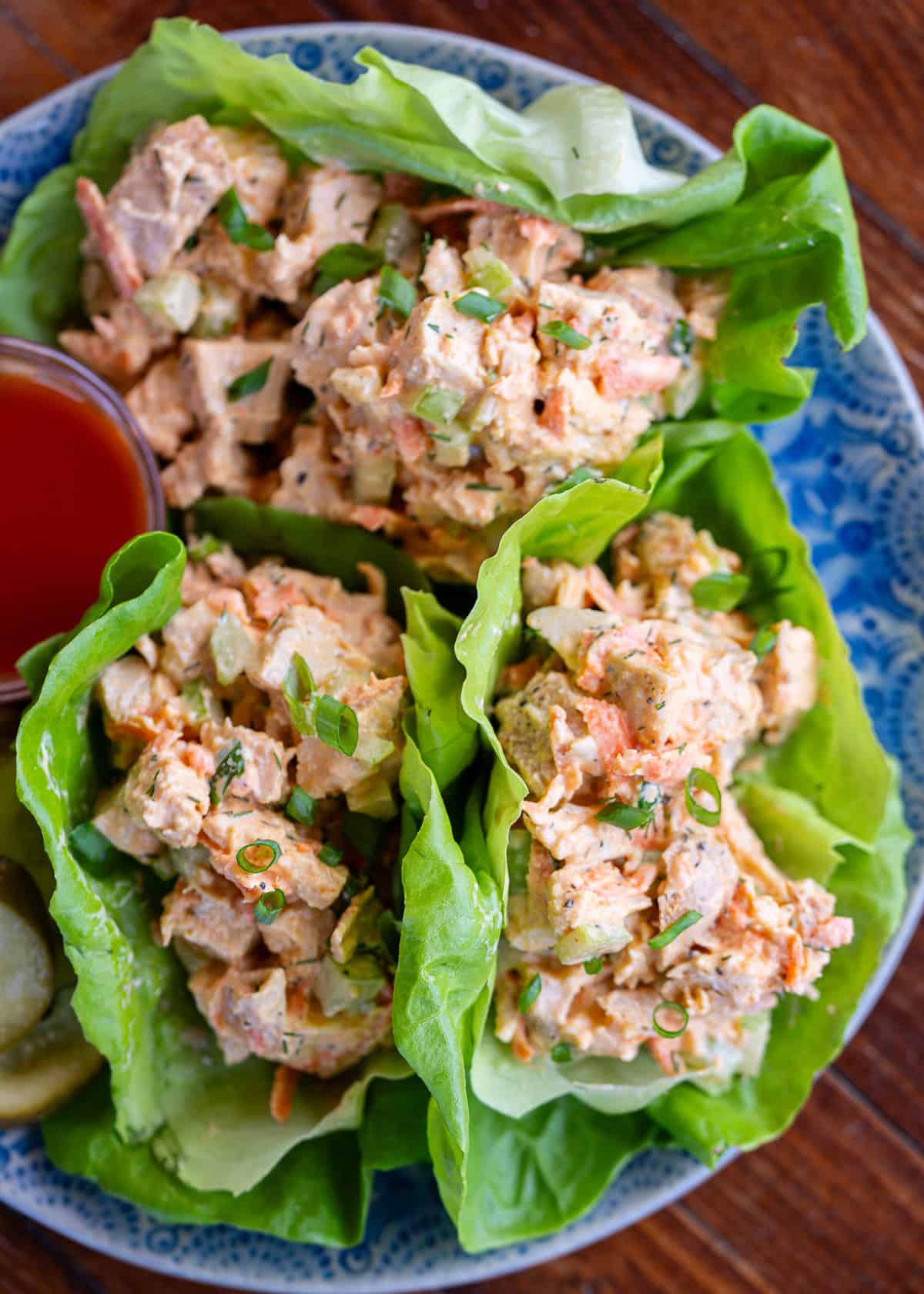 an overhead shot of high protein buffalo chicken salad in lettuce cups
