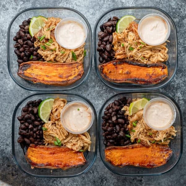an overhead shot of sweet potato and chicken meal prep bowls