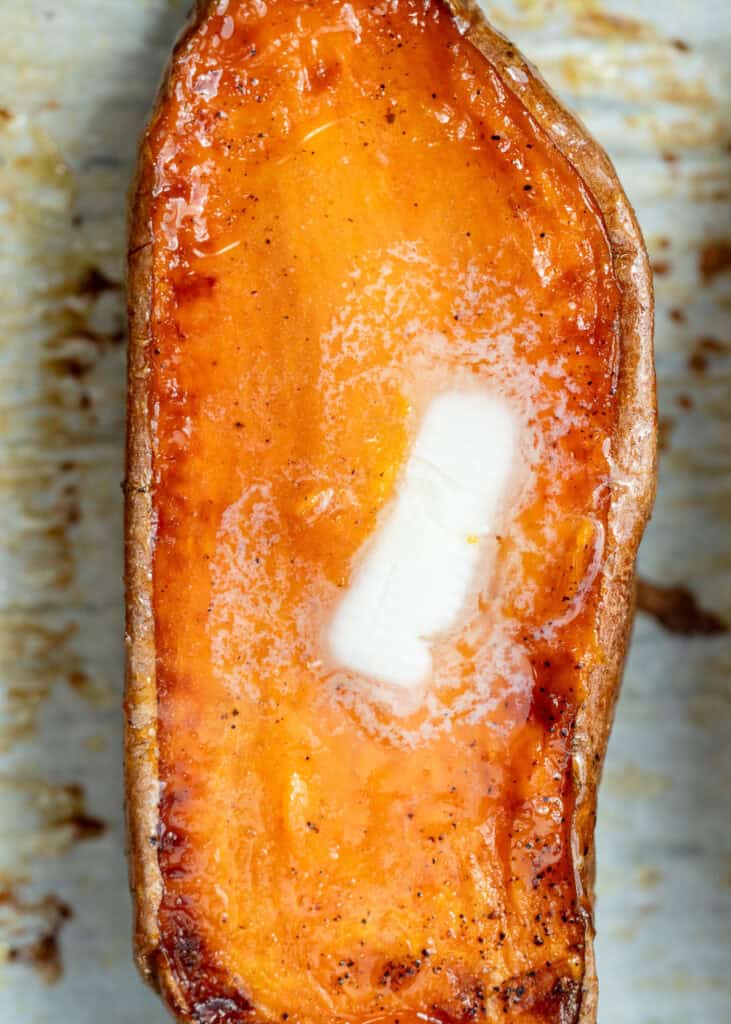 an up close shot of a buttery sweet potato